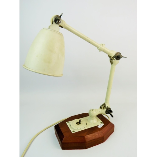 320 - Vintage, Engineers angle poise lamp with friction joints and wing nut tensioners. Stands on a wooden... 