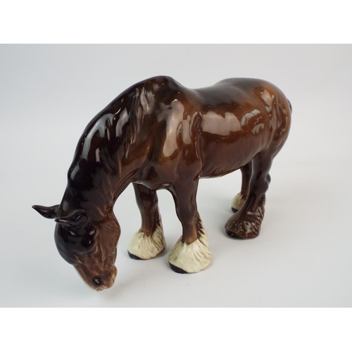 231 - Beswick brown grazing shire horse, Model no 1050.