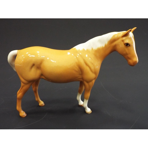 239 - Royal Doulton Palomino pony.