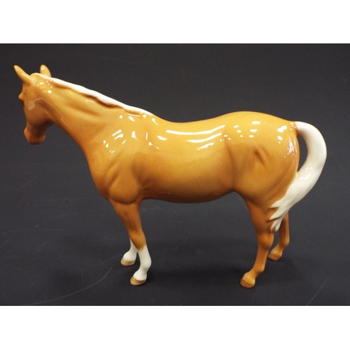 239 - Royal Doulton Palomino pony.