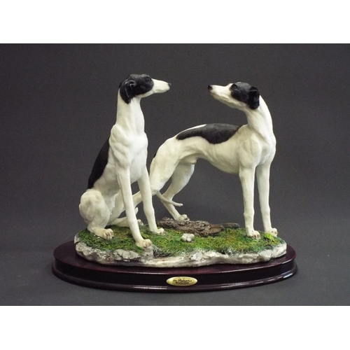 283 - Juliana Collection figurine of a pair of greyhounds on a wooden base. Approx 8.5