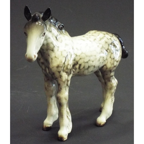 338 - Rare Beswick Shire foal in rocking horse grey, Model no 1053