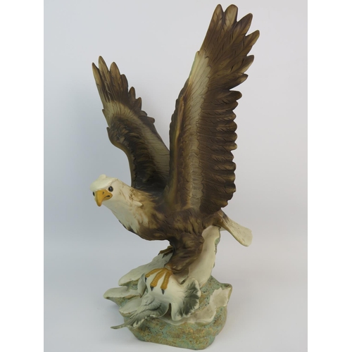 358 - Bisque porcelain model of an Eagle with prey measures 15 inches tall. (invisible glued repair to bea... 