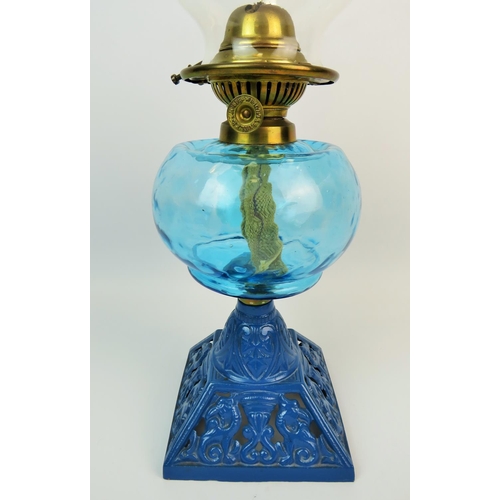 365 - Pretty oil lamp with pierced cast metal base, Turquoise glass reservoir, glass chimney. 13 inches ta... 