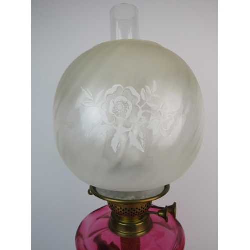 369 - Duplex,  Brass & Glass Antique Oil lamp which has a heavy brass base, Cranberry glass reservoir, Gla... 