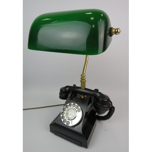 378 - Cleverly made table lamp as an old Bakelite telephone. Green glass bankers lamp shade. Approx height... 