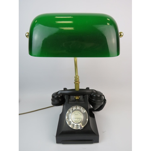 378 - Cleverly made table lamp as an old Bakelite telephone. Green glass bankers lamp shade. Approx height... 