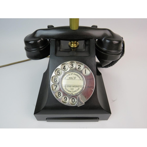 378 - Cleverly made table lamp as an old Bakelite telephone. Green glass bankers lamp shade. Approx height... 