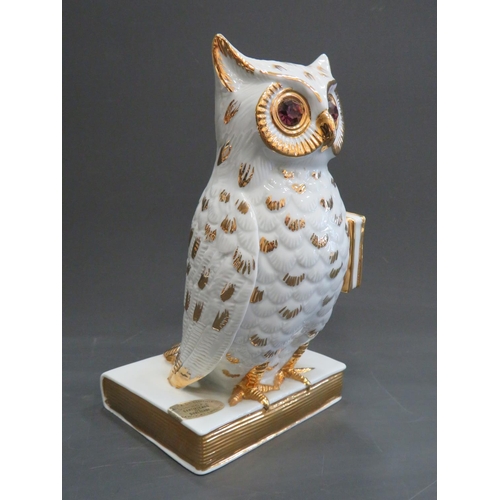 390 - Limoge porcelain characature figure of a Wise Owl perched on a book. Hand applied gilt decoration wi... 