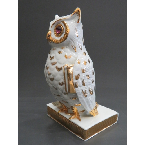 390 - Limoge porcelain characature figure of a Wise Owl perched on a book. Hand applied gilt decoration wi... 