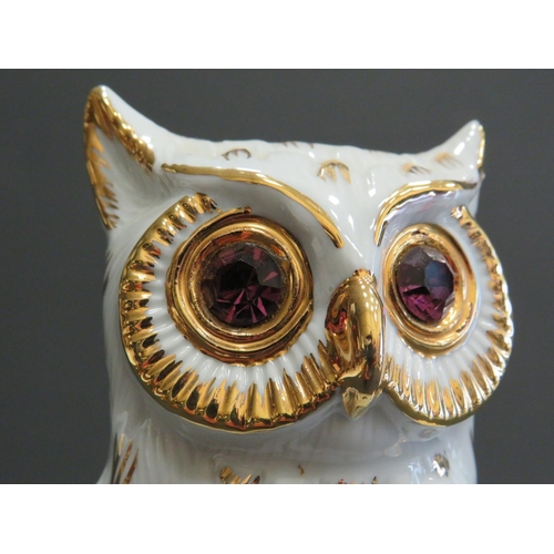 390 - Limoge porcelain characature figure of a Wise Owl perched on a book. Hand applied gilt decoration wi... 