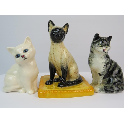 394 - Two Royal Doulton Cat figures plus one other. The tallest being 4 inches tall. See photos.