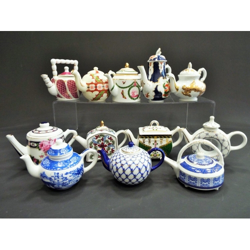 426 - 12 miniature china teapots.