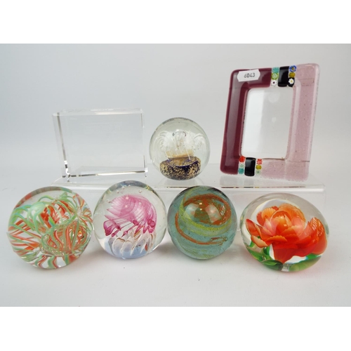 453 - Selection of paperweights and a small art glass picture frame.