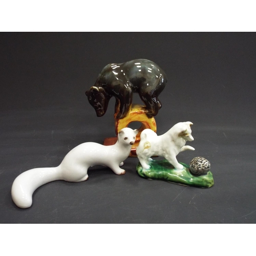 466 - 3 Russian figurines of a Bear, stoat and a dog with a hedgehog.