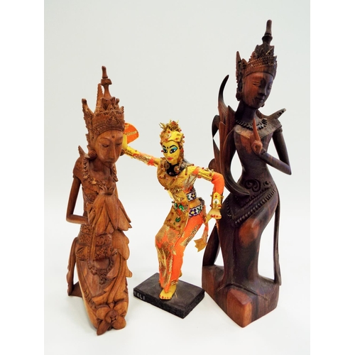 493 - 2 Wooden indian carved deity figurines plus one other.