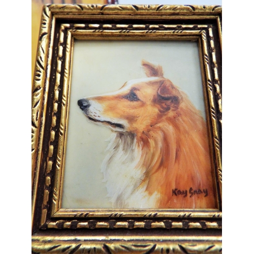 512 - A Pair of framed handpainted miniatures of dogs signed Kay Sney plus a wall plaque.