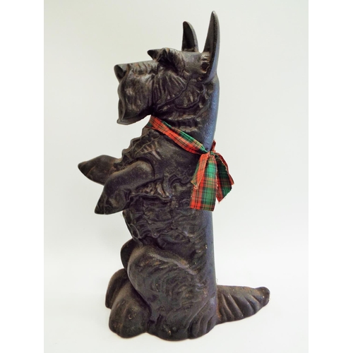 532 - Vintage cast iron scotty dog door stop which stands approx 14.5