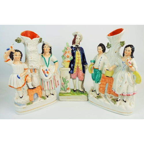 550 - 2 Staffordshire flat back spill vases and a flatback figurine.