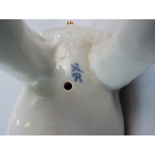 555 - Porcelain figurine of a Pug dog, standing 8