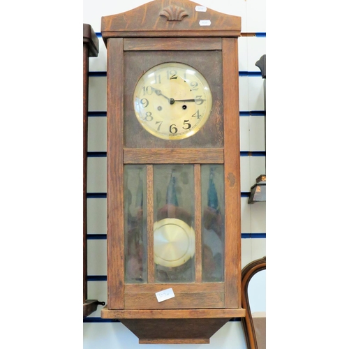 303a - Vintage Oak cased chiming wall clock intermittent running order. front glass damaged. consider as sp... 