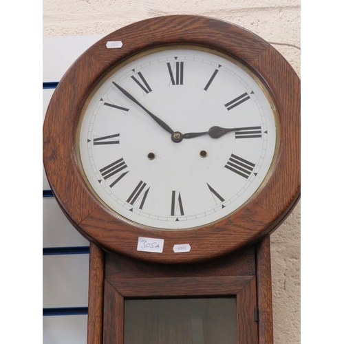 305A - American made Chiming regulator clock in very good working order. plain white face with Roman numera... 