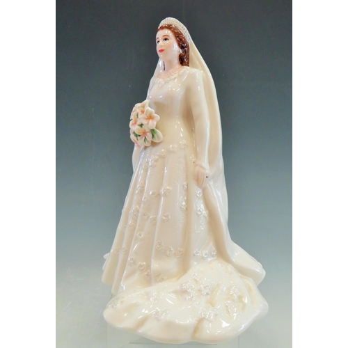 35 - Royal Worcester Figurine of Queen Elizabeth II.  9 inches tall. See photos.