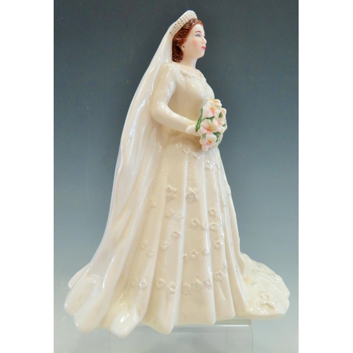 35 - Royal Worcester Figurine of Queen Elizabeth II.  9 inches tall. See photos.