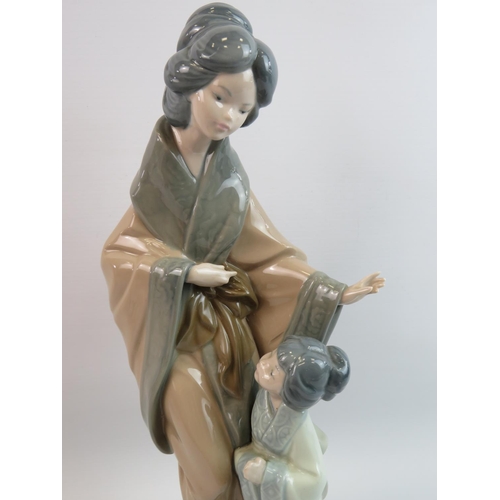 36 - Nao Figurine of Geisha with child. Measures 15 inches tall. See photos.