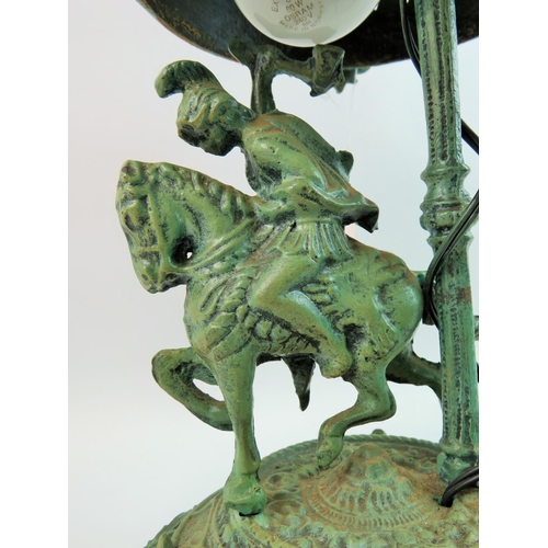 59 - Unusual cast metal lamp with pierced metal shade featuring a Greco Roman mounted Warrior to base. Ap... 