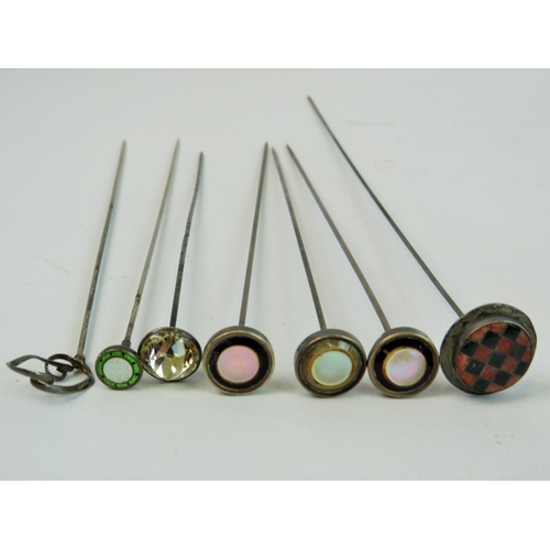 74 - Nine Hatpins , Some marked Sterling Silver, together with a Vintage Silver plated hatpin stand