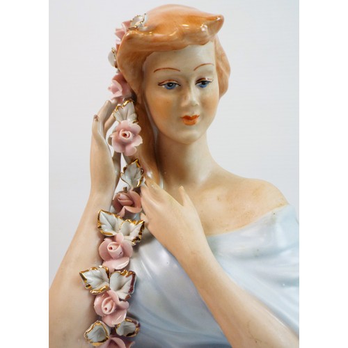 77 - Apulum lucra manual bust of a lady with plaited flowers in her hair. Standing approx 9.5