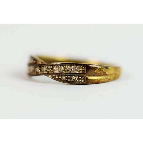 218 - 9ct Yellow Gold multi Diamond set Crossover ring.  Finger size  'P'   1.9g  0918