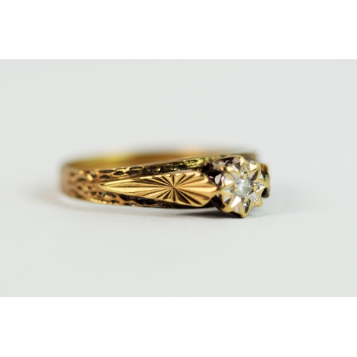 219 - 9ct Yellow Gold ring set with an Illusion set Diamond with a scrolled leaf setting.  Finger size 'M'... 