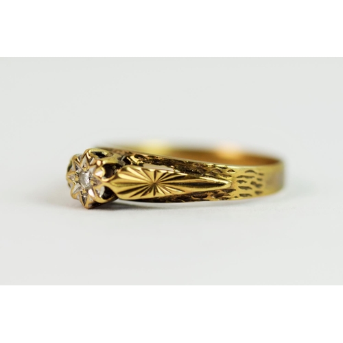 219 - 9ct Yellow Gold ring set with an Illusion set Diamond with a scrolled leaf setting.  Finger size 'M'... 