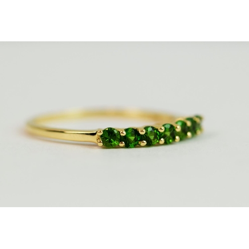 228 - 9ct  Yellow Gold ring set with an Oval Green stone. Finger size 'S-5'  1.9g