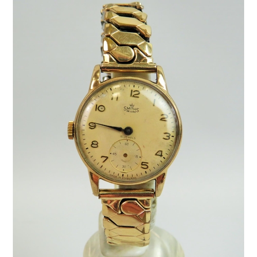 517 - Smiths De-lux 15 jewel vintage watch with 9ct Yellow gold case, gold tone expanding strap. Non runne... 