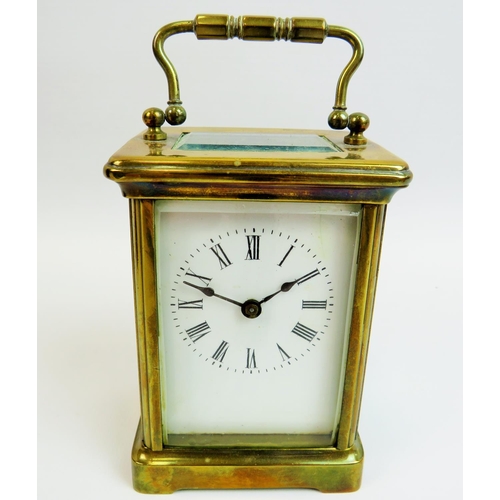 521 - Vintage Brass cased skeleton carriage clock with glass sides and top to show mechaninsm and escapeme... 