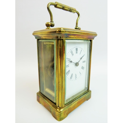 521 - Vintage Brass cased skeleton carriage clock with glass sides and top to show mechaninsm and escapeme... 