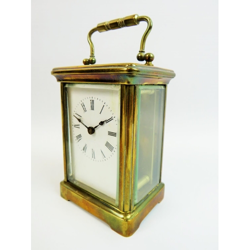 521 - Vintage Brass cased skeleton carriage clock with glass sides and top to show mechaninsm and escapeme... 