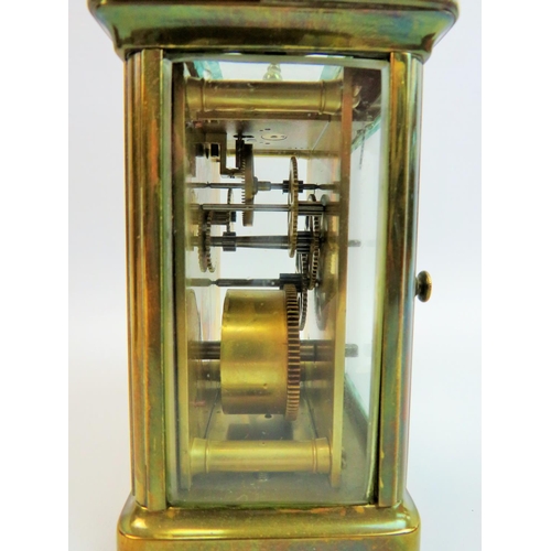 521 - Vintage Brass cased skeleton carriage clock with glass sides and top to show mechaninsm and escapeme... 