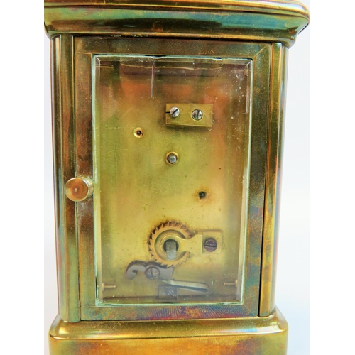 521 - Vintage Brass cased skeleton carriage clock with glass sides and top to show mechaninsm and escapeme... 