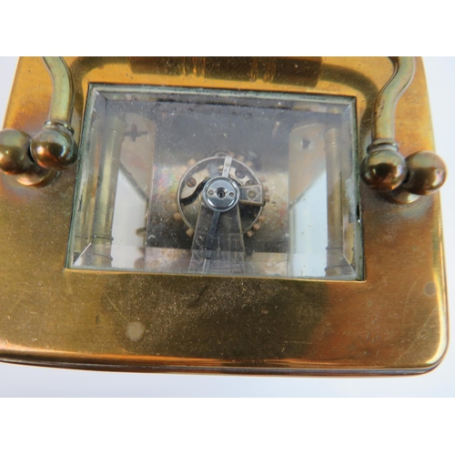 521 - Vintage Brass cased skeleton carriage clock with glass sides and top to show mechaninsm and escapeme... 