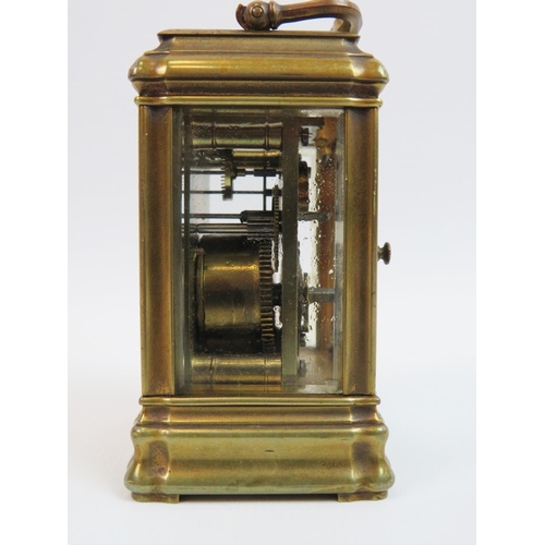 522 - Small brass skeleton carriage clock with glass sides and top to show mechanism and escapement. Comes... 