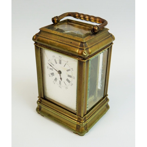 522 - Small brass skeleton carriage clock with glass sides and top to show mechanism and escapement. Comes... 