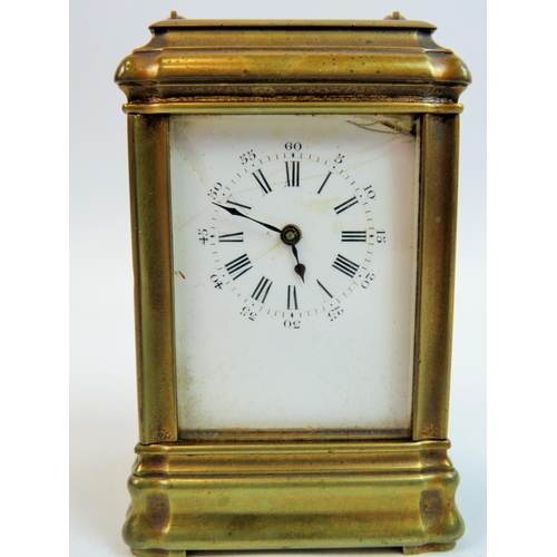 522 - Small brass skeleton carriage clock with glass sides and top to show mechanism and escapement. Comes... 