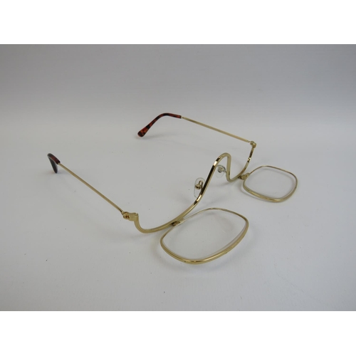 542 - A pair of seemingly new and unused designer sunglasses along with a pair of hinged lens reading glas... 