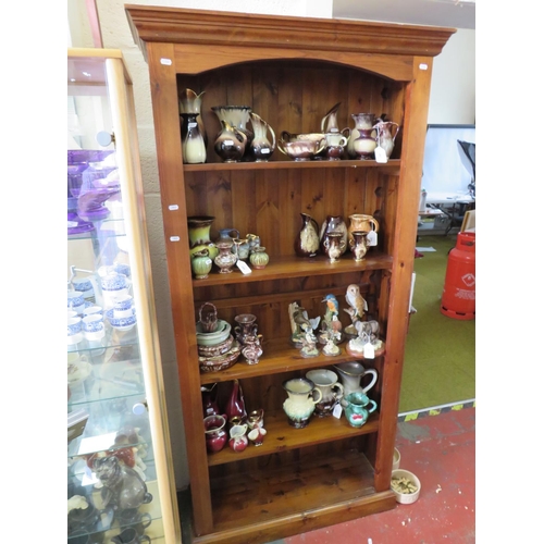 552 - Good Strong pine bookcase in dark stain with four adjustable shelves. Measures H:72  X W:36 x D:11 i... 