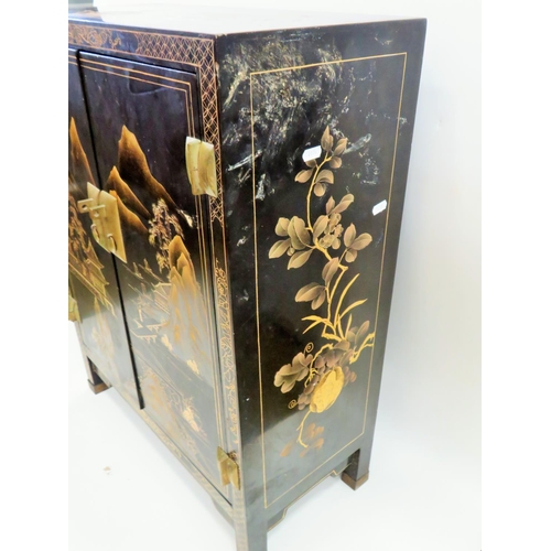 554 - Lovely Chinoiserie laquered cabinet with double door. Beautiful decoration to three sides showing Mo... 