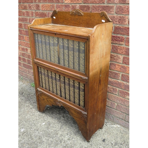 566 - Double fronted drop door bookcase, purposely built and containing 24 editions of the 1929 Encycloped... 